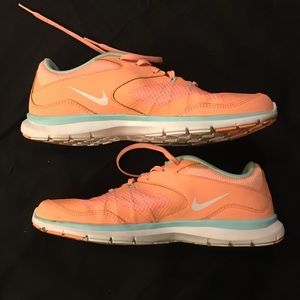 Womens salmon Nike flex training sneakers.